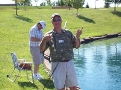 Man fishing & smiling